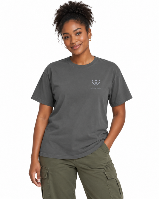 Between Worlds heavyweight tee Pepper — studio front lifestyle — front view