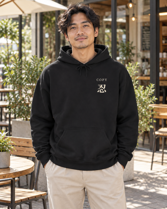 AI-generated lifestyle mockup of Copy Study Kanji Anime Hoodie in black on an adult model