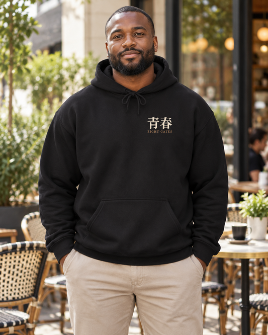 AI-generated lifestyle mockup of Eight Gates Training Kanji Anime Hoodie in black on an adult model