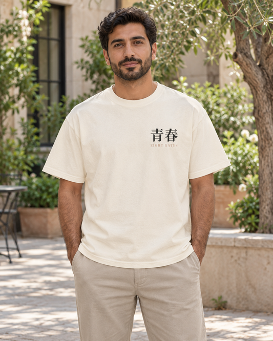 AI-generated lifestyle mockup of Eight Gates Training Kanji Anime Tee in ivory on an adult model