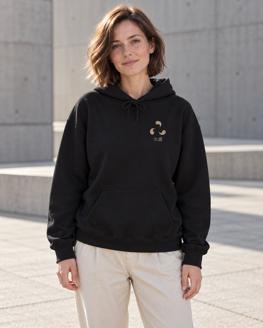 AI-generated lifestyle mockup of Ember Legacy Minimalist Anime Hoodie in black on an adult model