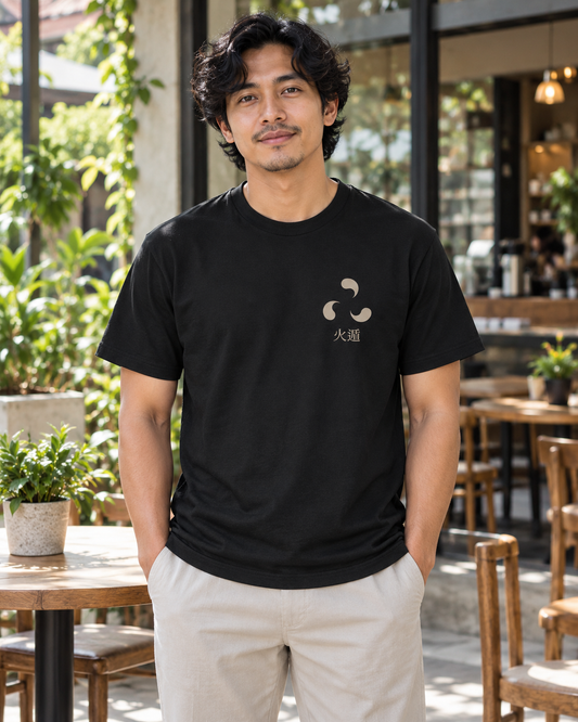 AI-generated lifestyle mockup of Ember Legacy Minimalist Anime Soft Tee in black on an adult model