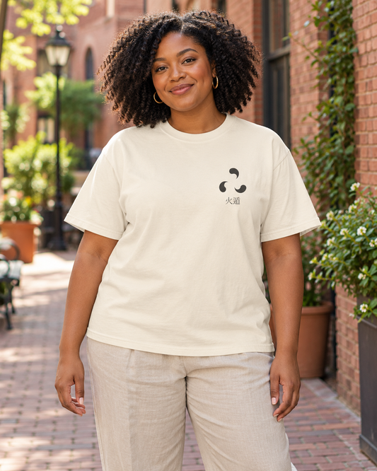 AI-generated lifestyle mockup of Ember Legacy Minimalist Anime Tee in ivory on an adult model