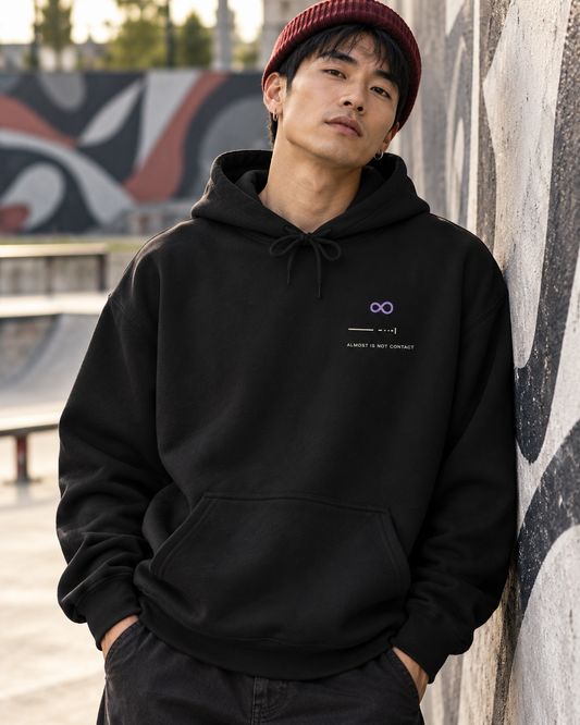 AI-generated lifestyle mockup of Limit Approaches Minimalist Anime Hoodie in black on an adult model