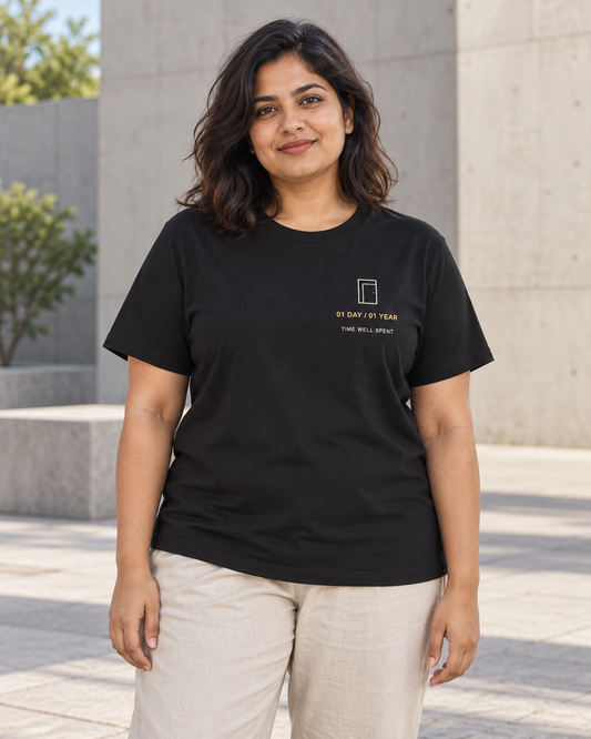 AI-generated lifestyle mockup of One Day One Year Minimalist Anime Soft Tee in black on an adult model