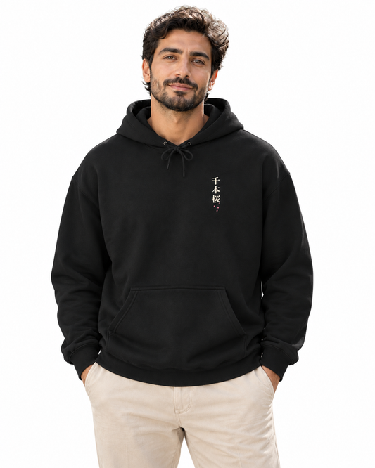 Quiet Bloom Kanji Hoodie in Black — studio lifestyle front view