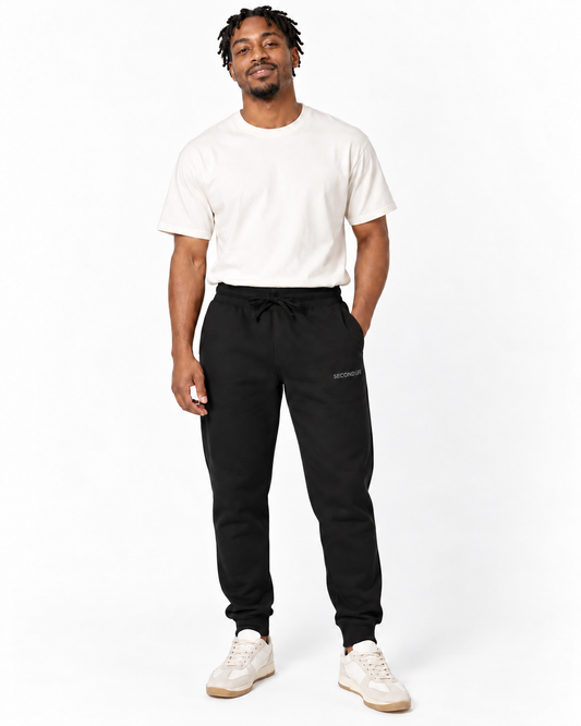 Second Life Embroidered Fleece Sweatpants in Black — studio front lifestyle — front view