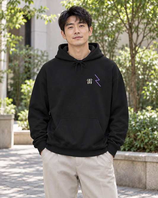 AI-generated lifestyle mockup of Storm Flame Kanji Anime Hoodie in black on an adult model