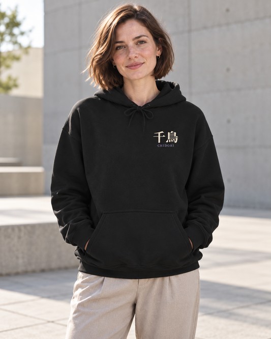 AI-generated lifestyle mockup of Storm Heir Kanji Anime Hoodie in black on an adult model