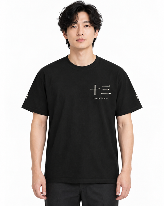 Thirteen Captain heavyweight tee in black — studio front lifestyle, white background