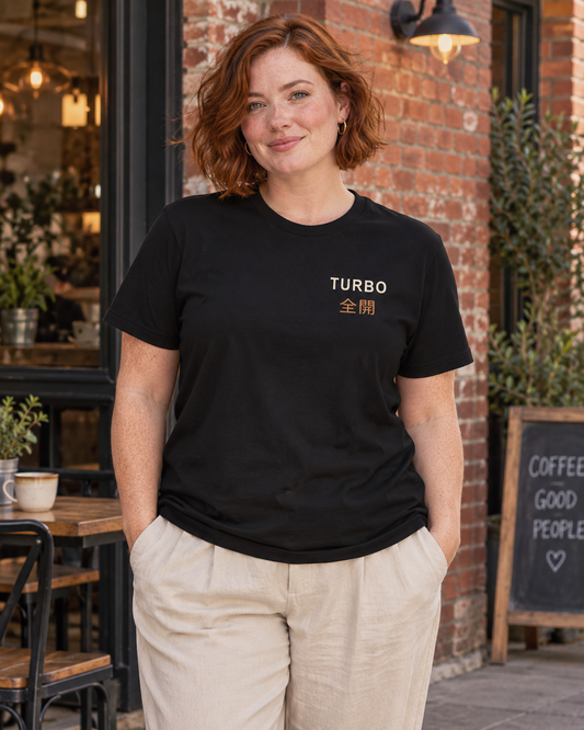 AI-generated lifestyle mockup of Tunnel Velocity Kanji Anime Soft Tee in black on an adult model