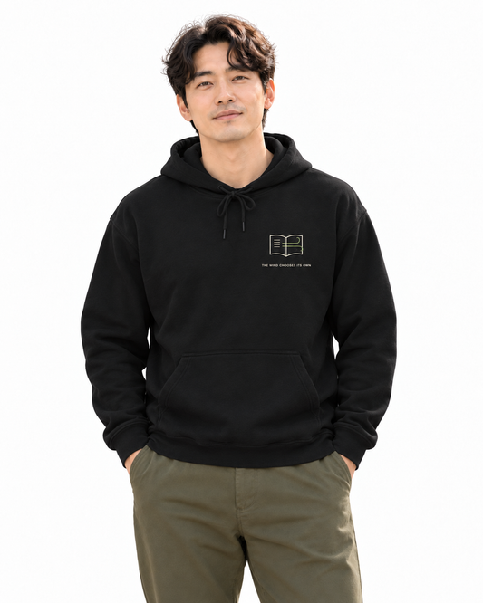 Wind Chooses Minimalist Hoodie in Black — studio front lifestyle — front view